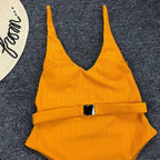 Buckled one-piece swimsuit in various colors and styles from 64b136-1e, featuring a sleek design and comfortable fit.