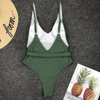 Colorful buckled one-piece swimsuit by 64b136-1e featuring adjustable straps and a stylish, fitted design for women.