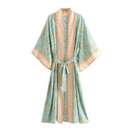 Boho Chic Turquoise Kimono outerwear with flowing fabric and bohemian style, featuring vibrant turquoise color and intricate patterns.