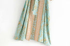 Boho Chic Turquoise Kimono outerwear with flowy fabric and bohemian style, featuring vibrant turquoise color and relaxed fit.