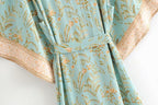Boho Chic turquoise kimono outerwear with flowing fabric and bohemian style, perfect for casual or festival wear.