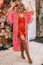 Red boho kimono cardigan from 64b136-1e, featuring flowing fabric and intricate patterns, styled as a lightweight, bohemian top.