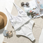 Buckled one-piece swimsuit by 64b136-1e in multiple colors, featuring a stylish design with adjustable buckle detail.