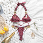 Triangle Boho Glamour Bikini swimwear in vibrant patterns, featuring a triangle top and matching bottoms, styled for beachwear.