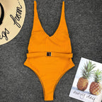 Colorful buckled one-piece swimsuit by 64b136-1e, featuring a stylish design with adjustable straps and a secure buckle detail.