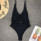 High cut one-piece swimsuit by 64b136-1e, featuring a sleek design and vibrant color, perfect for beach or poolwear.