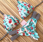 Brazilian tropical bikini swimwear by 64b136-1e, featuring vibrant tropical print and classic bikini style.