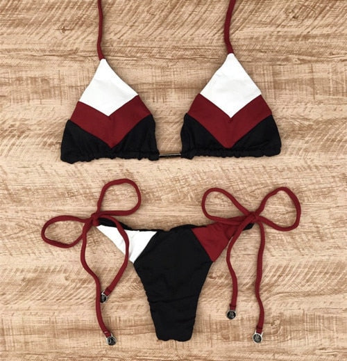Brazilian tropical bikini swimwear by 64b136-1e featuring colorful floral patterns and a stylish two-piece design.