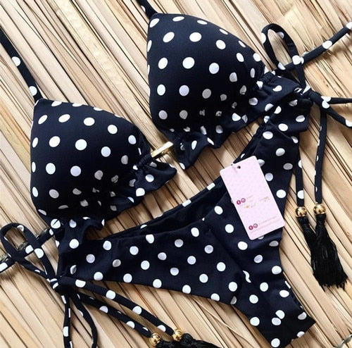 Brazilian tropical bikini swimwear by 64b136-1e featuring colorful floral patterns and a classic bikini cut.