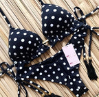Brazilian tropical bikini swimwear by 64b136-1e featuring colorful floral patterns and a classic bikini cut.