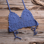 Crochet bikini with shell tassels, stylish swimwear by 64b136-1e, featuring a textured crochet top and shell accents.