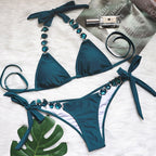 Triangle Boho Glamour Bikini's swimwear by 64b136-1e featuring a stylish boho-inspired triangle bikini top and matching bottoms.