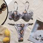 Snake print high cut bikini swimwear by 64b136-1e featuring a stylish low-rise design and vibrant snake pattern.