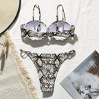 Snake print high cut bikini from 64b136-1e swimwear collection, featuring a stylish and vibrant snake pattern design.