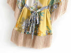 Kimono mini dress with tassels from 64b136-1e, featuring a flowy silhouette and decorative tassel details.