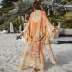 Floral print orange kimono swimwear by 64b136-1e, lightweight cover-up with vibrant floral patterns and flowing fabric.