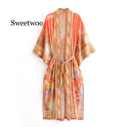 Floral print orange kimono swimwear by 64b136-1e, lightweight cover-up with vibrant floral patterns and flowing fabric.