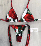 Brazilian tropical bikini swimwear with colorful floral print and adjustable side ties, designed for beach and pool wear.