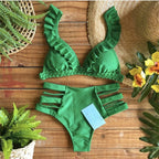Brazilian tropical bikini swimwear by 64b136-1e featuring colorful tropical print and adjustable bikini top and bottom.