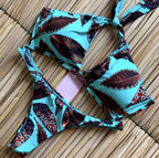 Brazilian tropical bikini swimwear by 64b136-1e featuring vibrant floral patterns and a stylish cut for beach and pool outings.