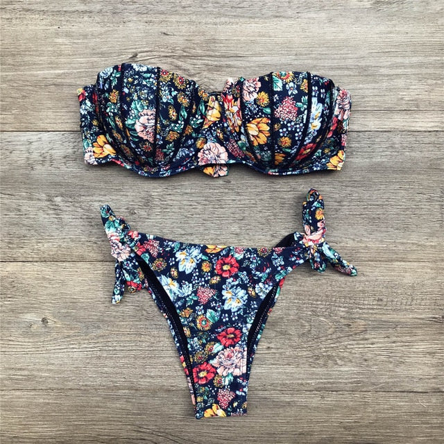 Floral print bandeau bikini swimwear by 64b136-1e featuring a strapless top and matching bottoms with vibrant floral patterns.