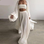 Three-piece boho set from 64b136-1e featuring a patterned top, pants, and a matching skirt displayed on a hanger.