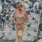 Gray knitted hollow-out maxi dress by 64b136-1e featuring a flowing silhouette and intricate open-knit details.