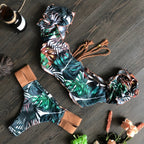 Ruffle low waist bikini set with multiple prints, stylish swimwear from 64b136-1e, featuring ruffled details and vibrant patterns.