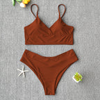 Two-piece Brazilian bathing suit from 64b136-1e, featuring colorful swimwear design with adjustable straps and bold pattern.