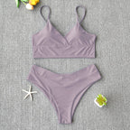 Brazilian two-piece bathing suit from 64b136-1e, featuring a stylish swimwear design with vibrant colors and adjustable ties.