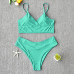 Brazilian two-piece bathing suit from 64b136-1e, featuring colorful swimwear with a triangle top and matching bikini bottoms.