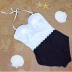 Women's one-piece swimsuit by 64b136-1e, featuring a stylish swimwear design, with a fitted silhouette and vibrant color.