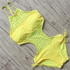 Colorful one-piece swimsuit by 64b136-1e, stylish swimwear in four vibrant colors, shown on a model.