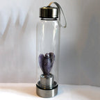 Natural Angel Crystal Water Bottle, hand carved, made of clear crystal, featuring an angel design, for decorative or spiritual use.