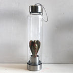 Hand-carved natural angel crystal water bottle by 64b136-1e, showcasing intricate crystal craftsmanship and unique design.