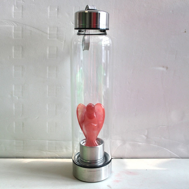 Hand-carved Natural Angel Crystal Water Bottle by 64b136-1e, featuring intricate angel designs and clear crystal appearance.