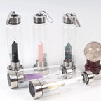 Clear natural crystal water bottle from 64b136-1e with a sleek design, showcasing the transparent glass and minimalist style.