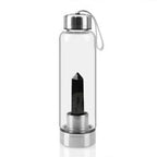 Clear natural crystal water bottles with airtight caps, showcasing smooth glass and textured surface for pure hydration.