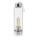 Clear natural crystal water bottles with wooden caps and glass body, designed for eco-friendly hydration.