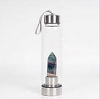 Clear natural crystal water bottle from 64b136-1e with a sleek design and transparent body, suitable for eco-friendly hydration.