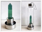 Clear natural crystal water bottles with wooden caps, showcasing the elegant, transparent design and smooth finish.