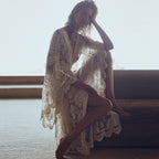 White lace kimono slip dress from 64b136-1e, featuring delicate lace details and a flowing, lightweight fabric.