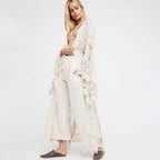 White lace kimono slip dress from 64b136-1e, featuring delicate lace fabric, V-neckline, and lightweight flowing design.