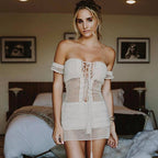 Off shoulder tassel crochet sundress by 64b136-1e featuring a boho style, lightweight fabric, and decorative tassels on the shoulders.