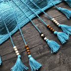 Crochet tassel crop bikini top in vibrant swimwear style, featuring intricate crochet details and colorful tassels.