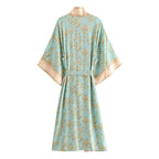 Boho Chic Turquoise Kimono outerwear with flowing fabric and bohemian style, featuring intricate patterns and relaxed fit.