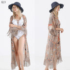 White fringed tassels kimono bikini cover-up with flowy fabric, perfect for beachwear, by 64b136-1e swimwear brand.