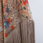 Kimono bikini cover with fringed tassels, lightweight swimwear in soft fabric, styled with open front and vibrant colors.